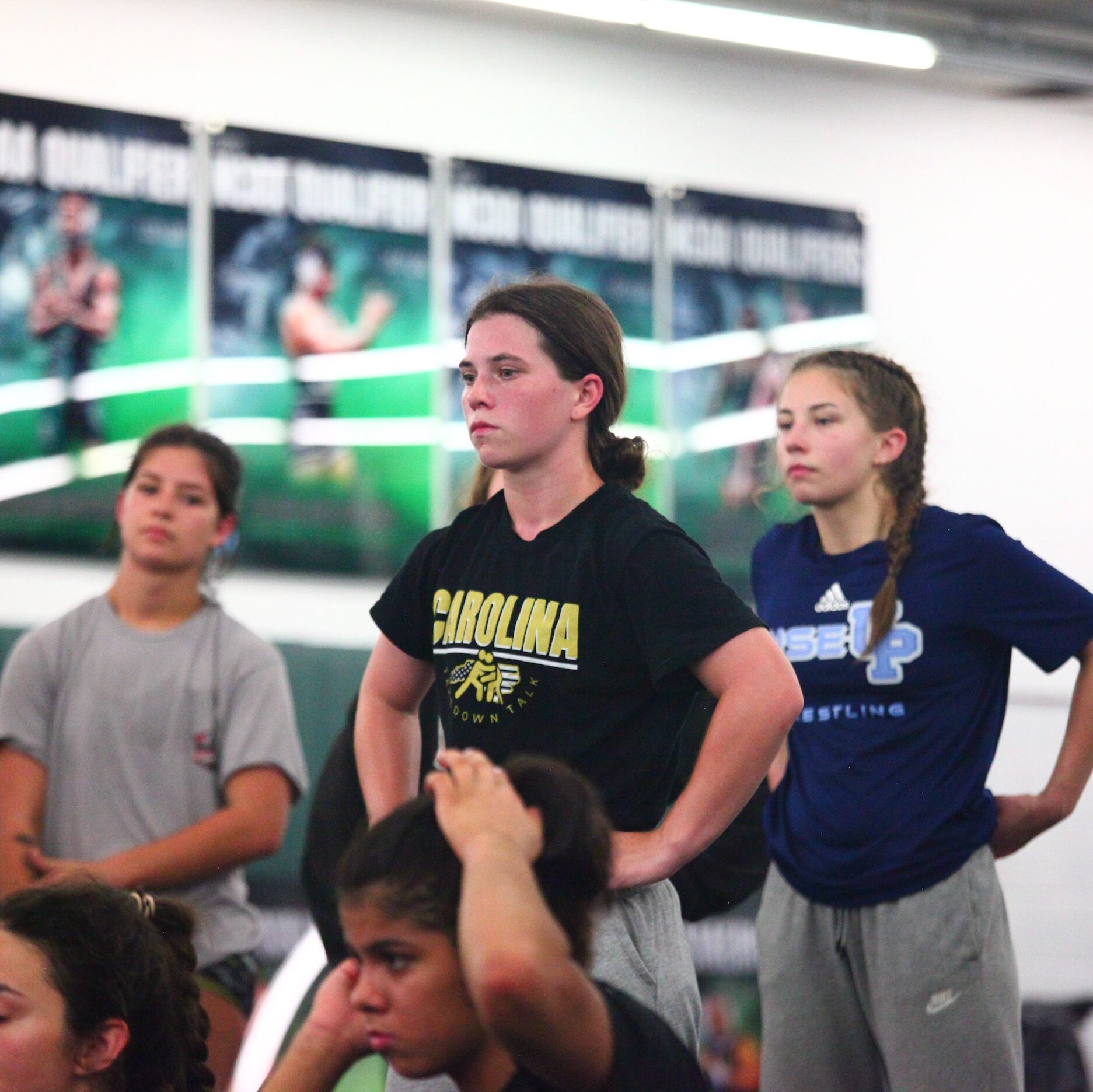Wrestlers listening during an NC United Gold practice