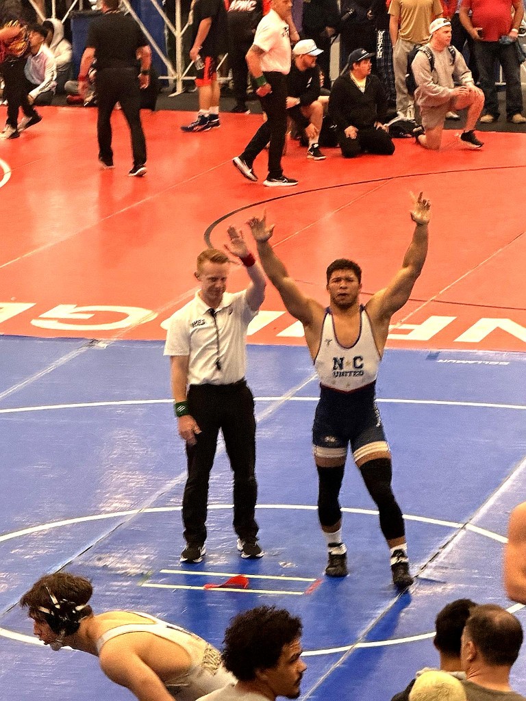 Dominic Blue celebrates after a win at the 2026 NHSCA Nationals