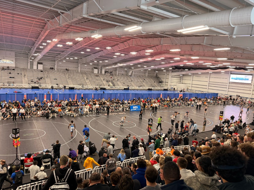Wide view of the mats and crowd at the 2026 NHSCA Nationals