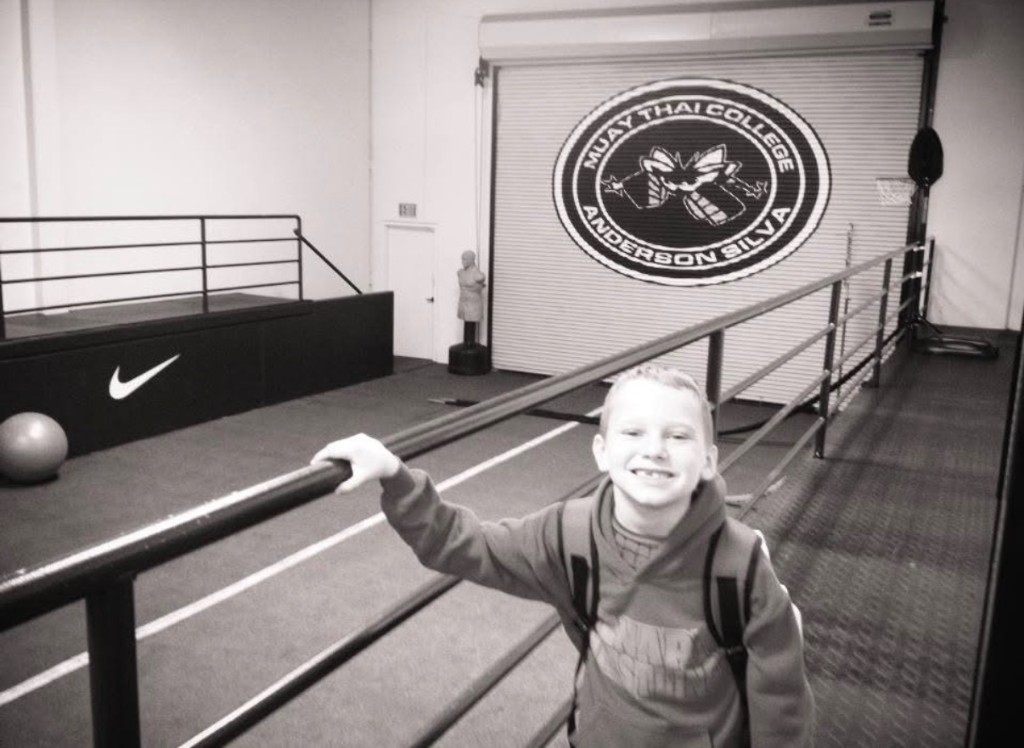 Caden Perry smiling at a martial arts training gym